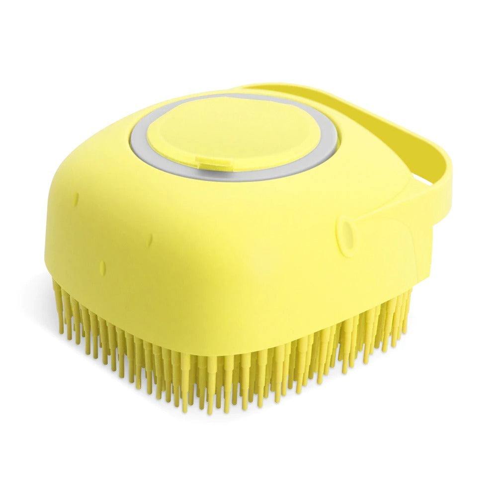 Yellow silicone pet dog shampoo massager brush for grooming and bathing.