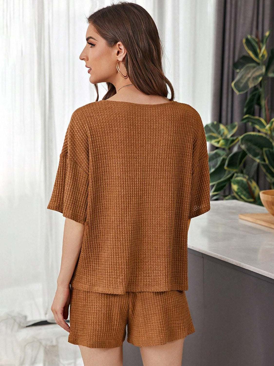 Full Size Waffle-Knit Dropped Shoulder TopExpress Global Mart  Features: Tied, Waffle-Knit
Number of pieces: Two-piece
Stretch: Slightly stretchy
Material composition: 100% polyester
Care instructions: Machine wash cold. Tumble Full Size Waffle-Knit Dropped Shoulder Top and Shorts SetTrendsi