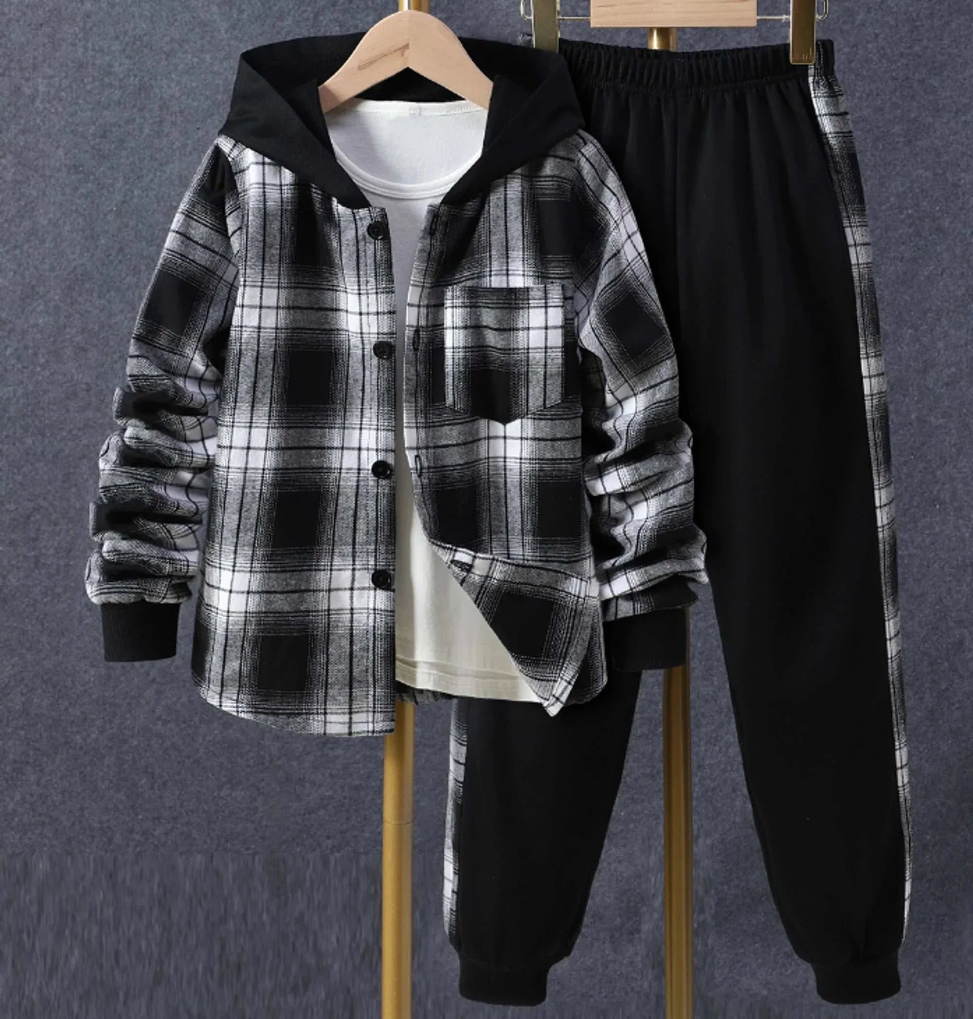 Black and white plaid toddler outfit with hoodie and pants, featuring comfortable fabric and easy closures.