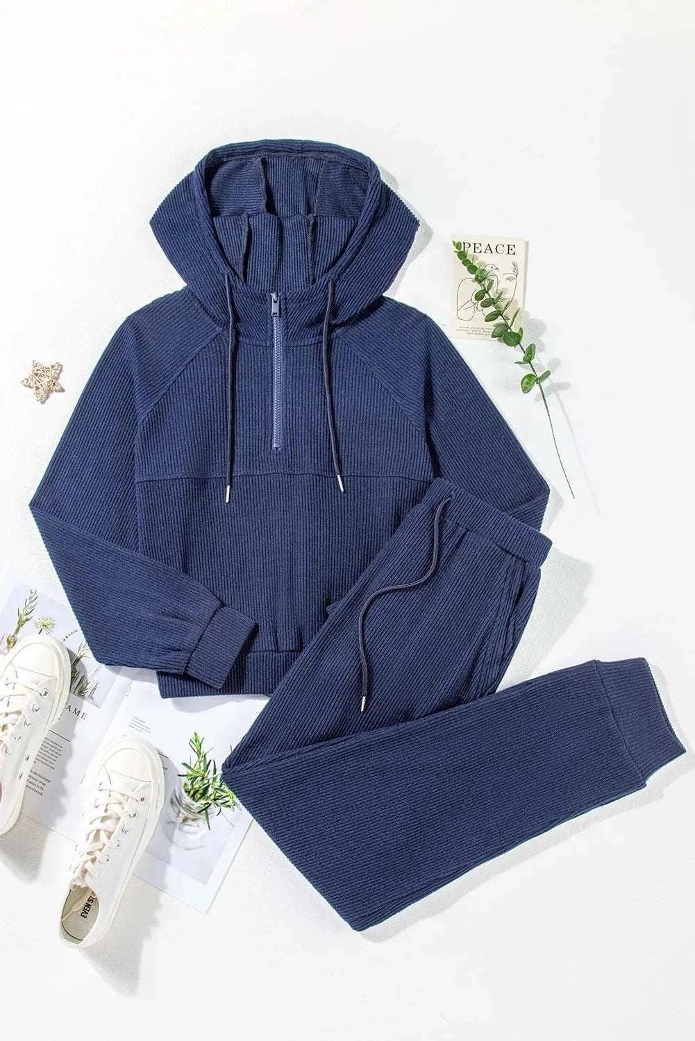 Drawstring Half Zip HoodieExpress Global Mart  Features: Drawstring
Number of pieces: Two-piece
Stretch: Slightly stretchy
Material composition: 95% polyester, 5% elastane
Care instructions: Machine wash cold. TuDrawstring Half Zip Hoodie and Joggers Active SetTrendsi