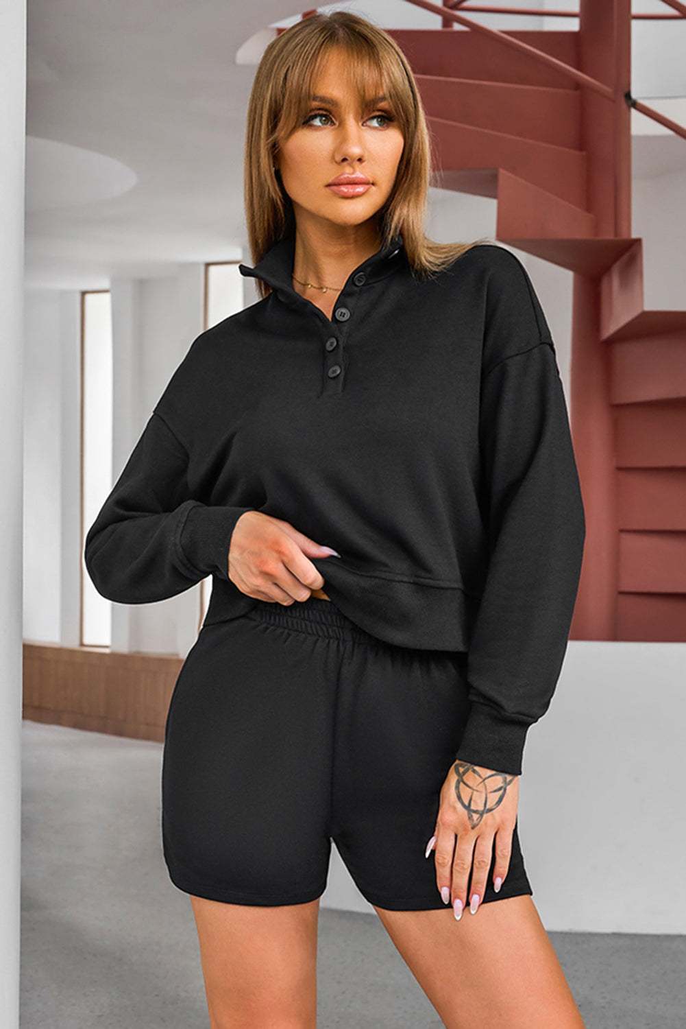 Half Button SweatshirtExpress Global Mart  Features: Pocketed
Number of pieces: Two-piece
Stretch: Slightly stretchy
Material composition: 65% polyester, 35% rayon
Care instructions: Machine wash cold. TumbleHalf Button Sweatshirt and Shorts Active SetTrendsi