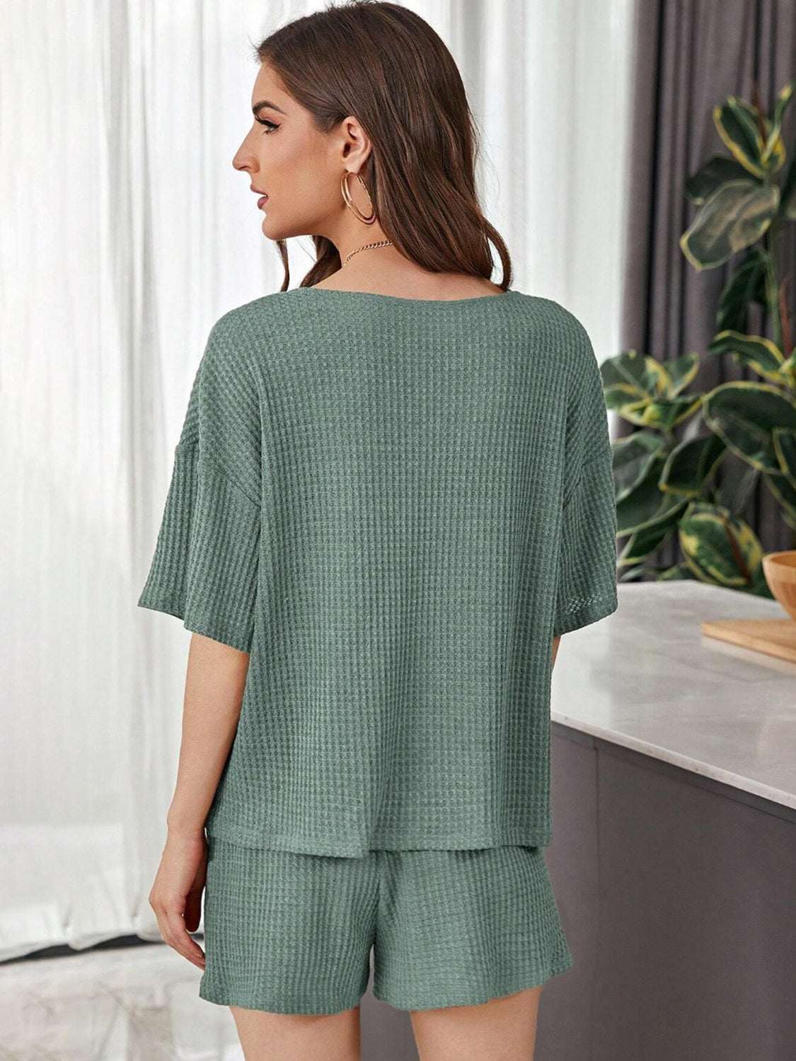 Full Size Waffle-Knit Dropped Shoulder TopExpress Global Mart  Features: Tied, Waffle-Knit
Number of pieces: Two-piece
Stretch: Slightly stretchy
Material composition: 100% polyester
Care instructions: Machine wash cold. Tumble Full Size Waffle-Knit Dropped Shoulder Top and Shorts SetTrendsi