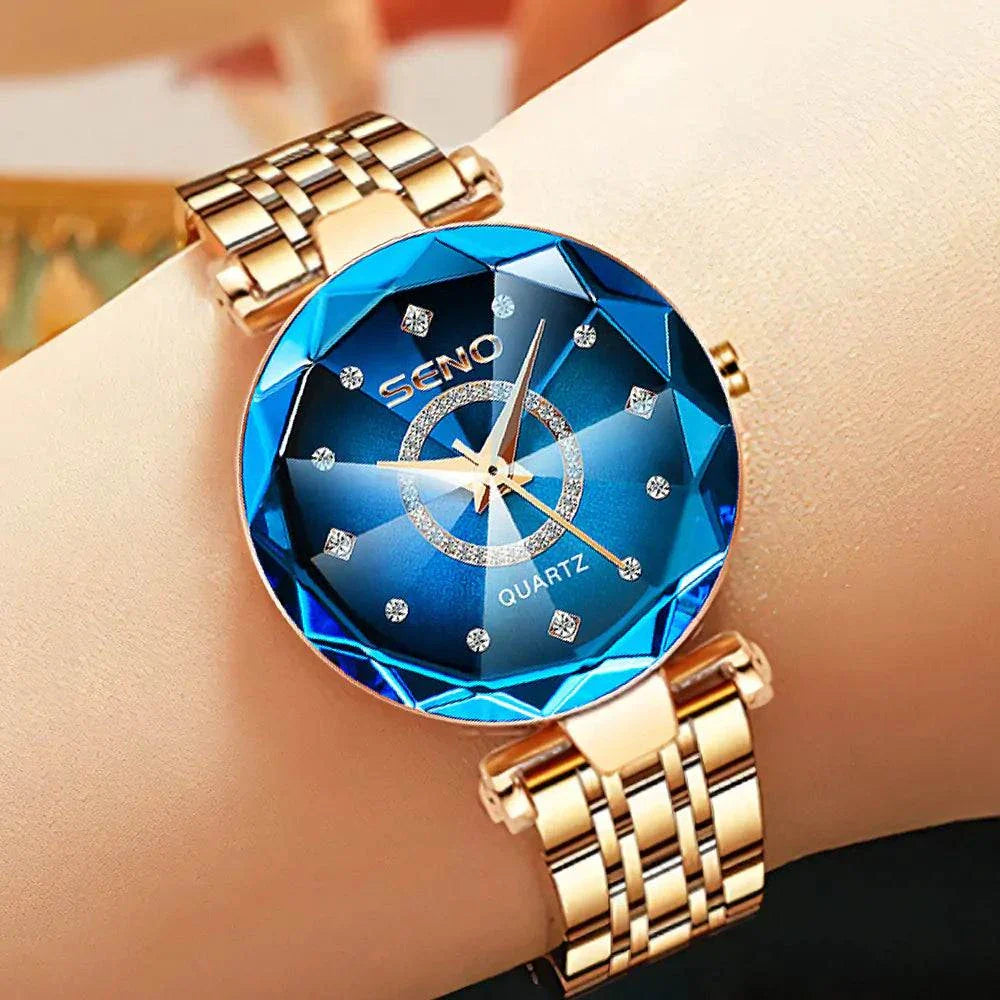 Elegant stainless steel quartz watch with blue dial and crystal accents.