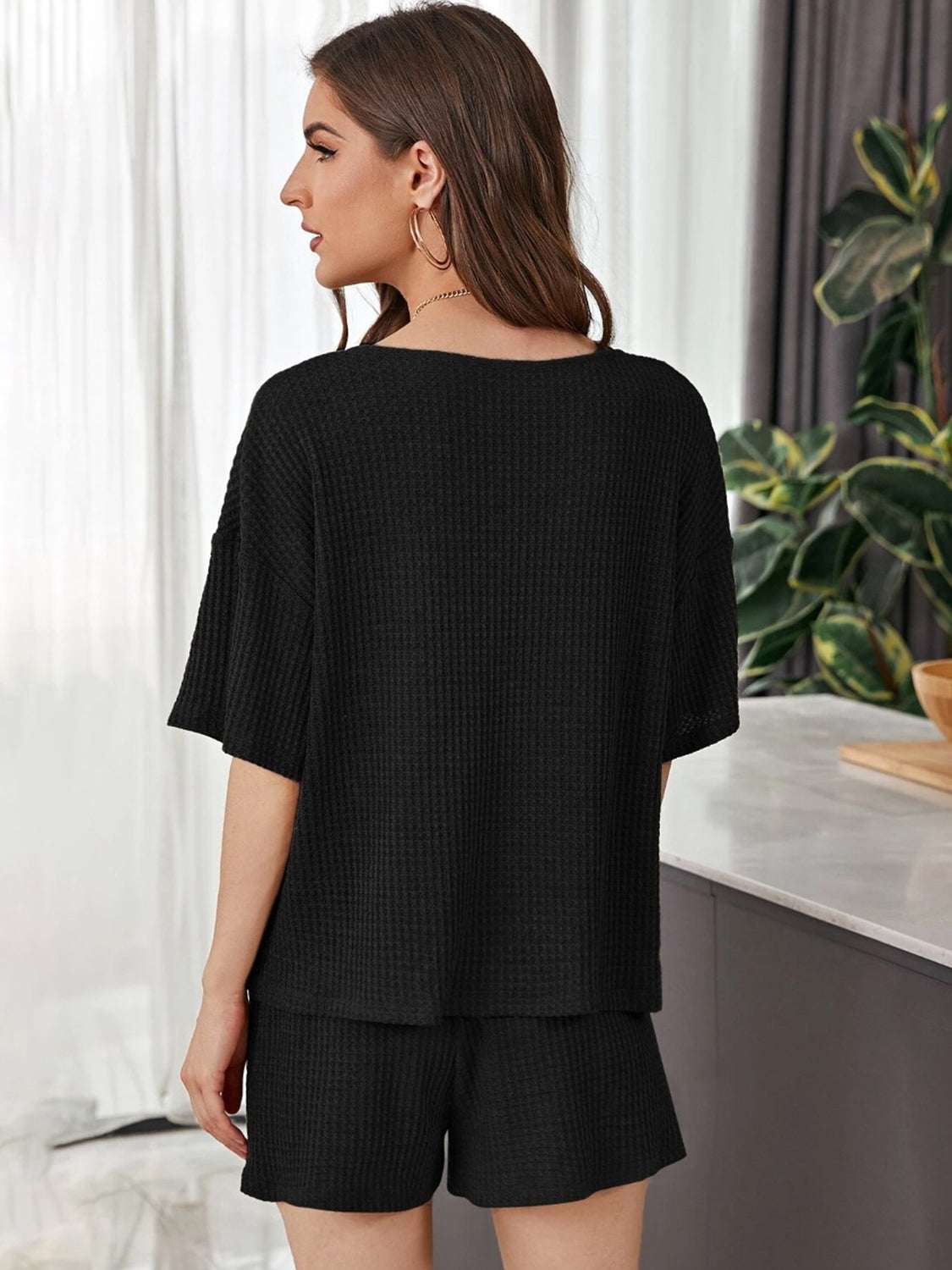 Full Size Waffle-Knit Dropped Shoulder TopExpress Global Mart  Features: Tied, Waffle-Knit
Number of pieces: Two-piece
Stretch: Slightly stretchy
Material composition: 100% polyester
Care instructions: Machine wash cold. Tumble Full Size Waffle-Knit Dropped Shoulder Top and Shorts SetTrendsi