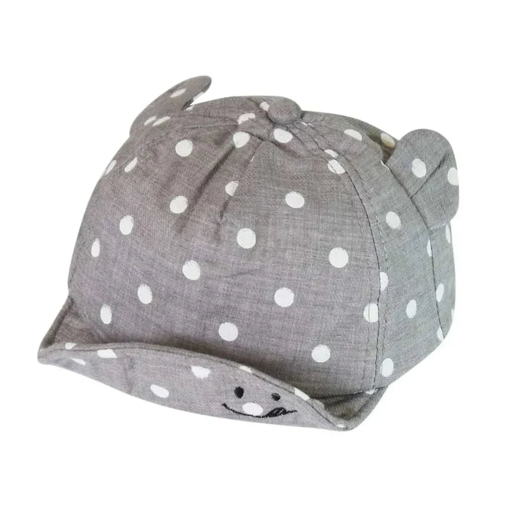 Toddler sun hat with cute dots, ear coverage, and charming design for UV protection.