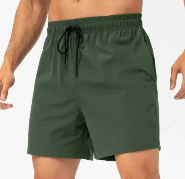 Loose Fitness Casual Running Shorts in green with adjustable waistband and side pockets.