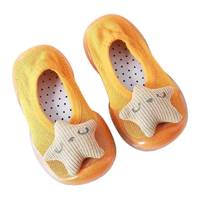 Adorable orange toddler shoes with anti-slip soles and warm built-in socks.