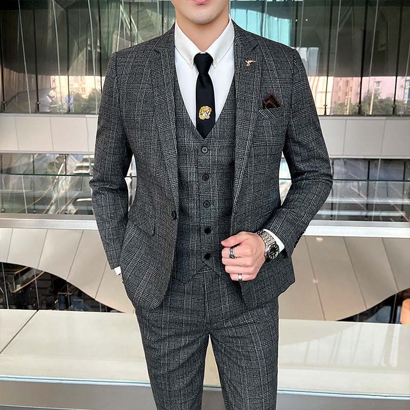 Korean-style three-piece banquet suit in dark gray with checkered pattern.