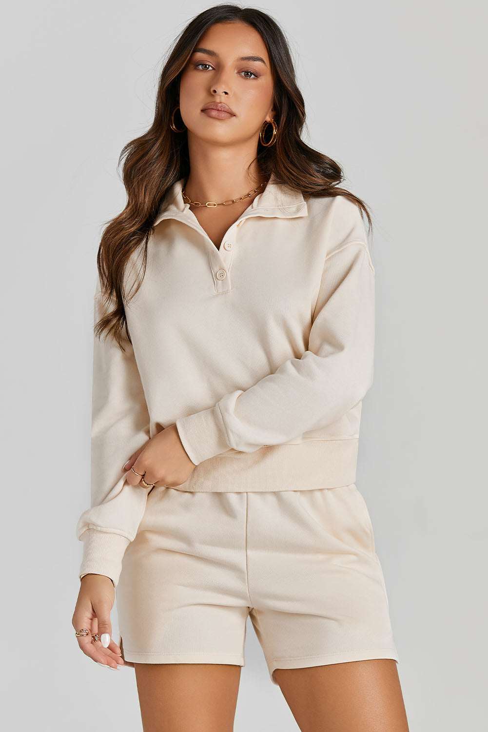 Half Button SweatshirtExpress Global Mart  Features: Pocketed
Number of pieces: Two-piece
Stretch: Slightly stretchy
Material composition: 65% polyester, 35% rayon
Care instructions: Machine wash cold. TumbleHalf Button Sweatshirt and Shorts Active SetTrendsi