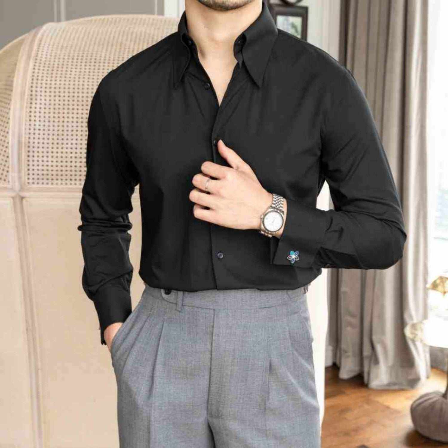 Big pointed collar wrinkle resistant slim fit black shirt in a stylish setting.