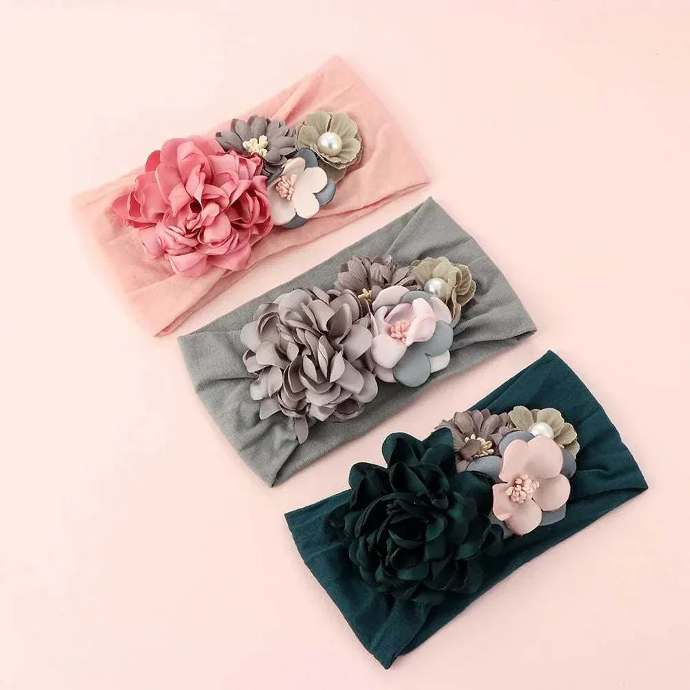 Toddler girls bow hairbands with 3D flowers, available in vibrant colors, perfect for stylish outfits.