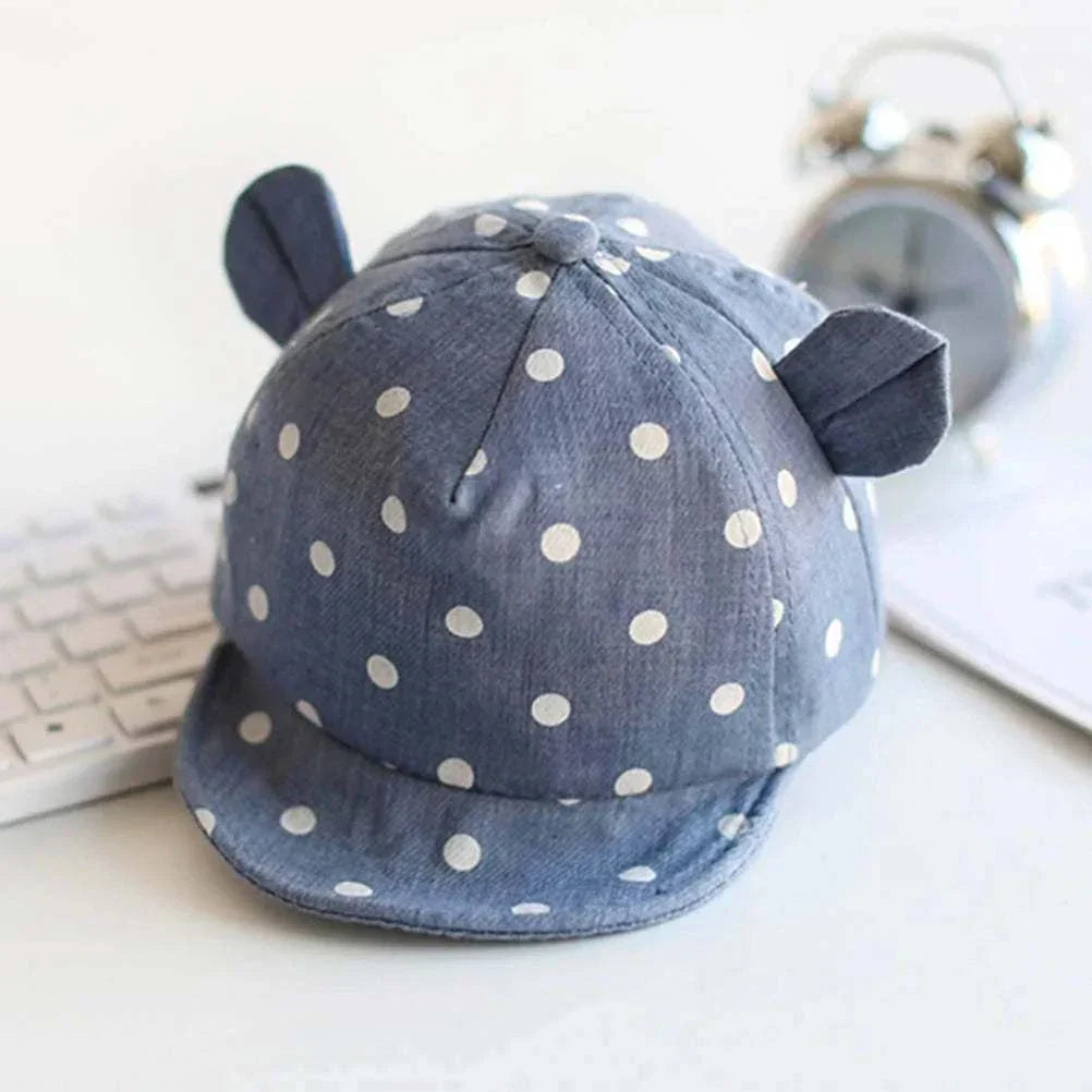 Toddler sun hat with cute dots, featuring ear coverage and playful design for UV protection.