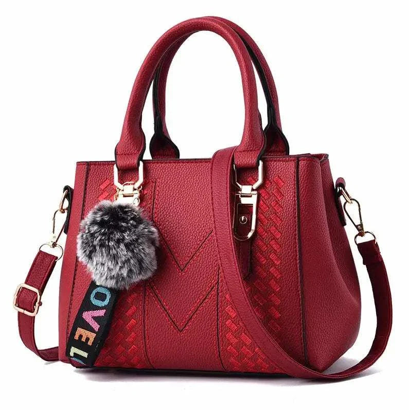 Embroidery Leather HandbagExpress Global Mart  Product Description
Introducing the Embroidery Leather Handbag, a perfect blend of elegance and practicality. This stylish satchel is designed for the modern woman wEmbroidery Leather HandbagDSers