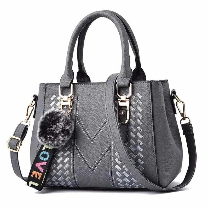 Embroidery Leather HandbagExpress Global Mart  Product Description
Introducing the Embroidery Leather Handbag, a perfect blend of elegance and practicality. This stylish satchel is designed for the modern woman wEmbroidery Leather HandbagDSers