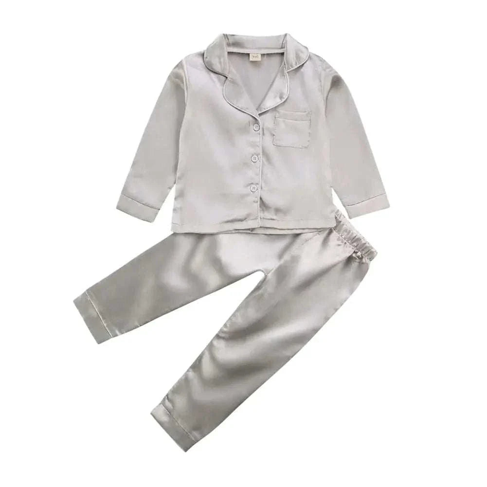 Luxurious silk satin toddler pajamas in gray, designed for comfort and safety.