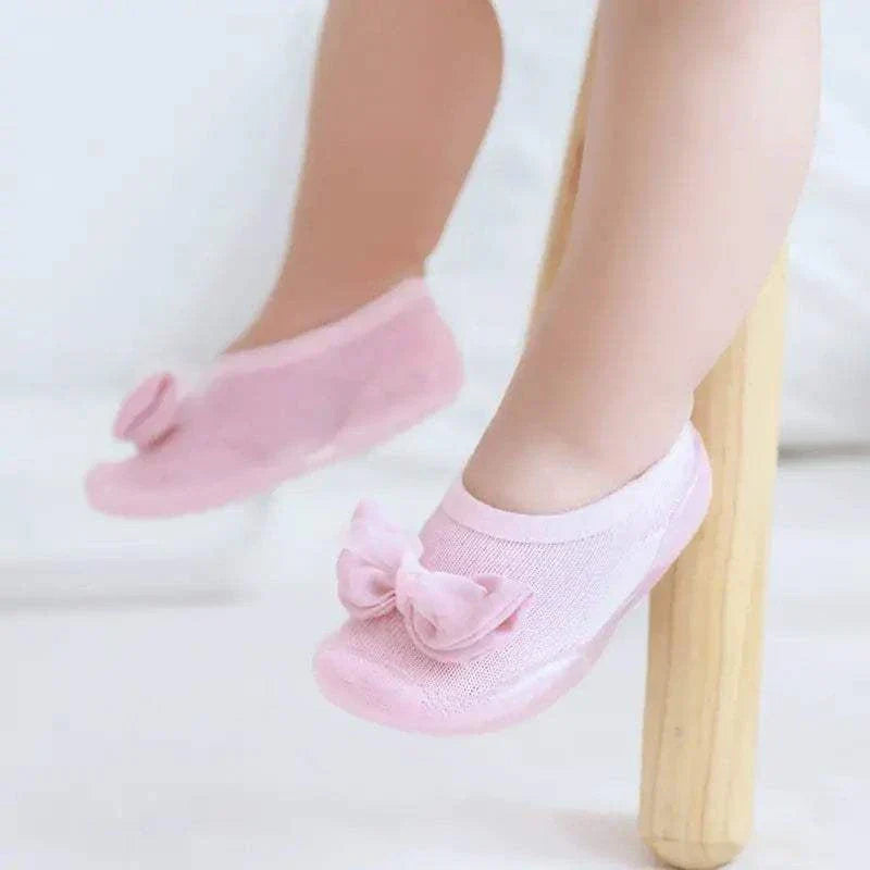 Pink toddler shoes with built-in socks and anti-slip soles for safety and comfort.