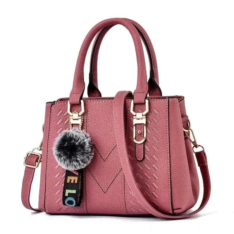 Embroidery pink bucket messenger handbag for women with adjustable strap.