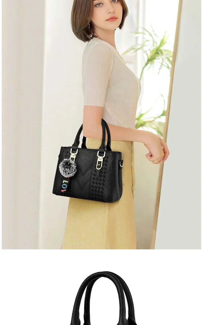 Embroidery messenger bag for women, perfect handbag with black bucket shape and decorative charm.