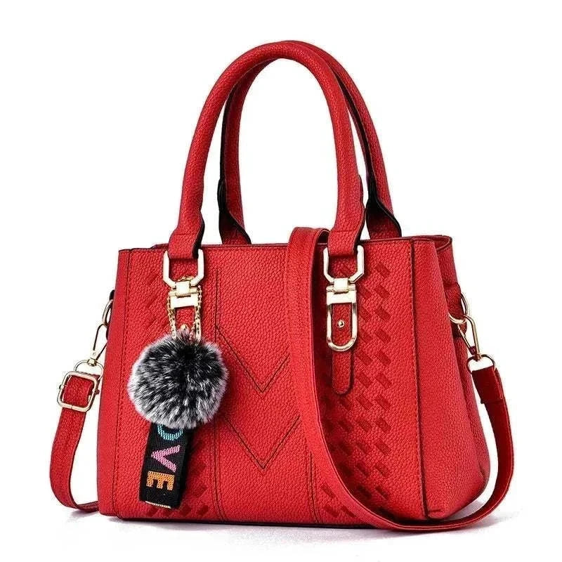 Embroidery messenger bag for women, red bucket shape with handles, ideal for everyday use.