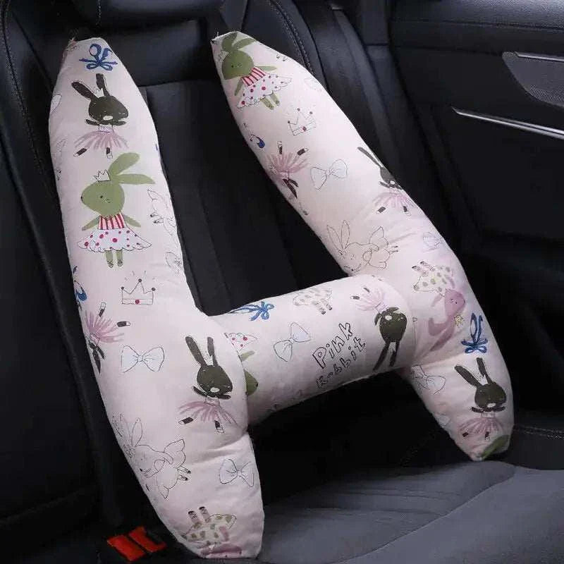 Kids car travel pillow with playful bunny and crown design, providing ergonomic neck support for comfortable car rides.