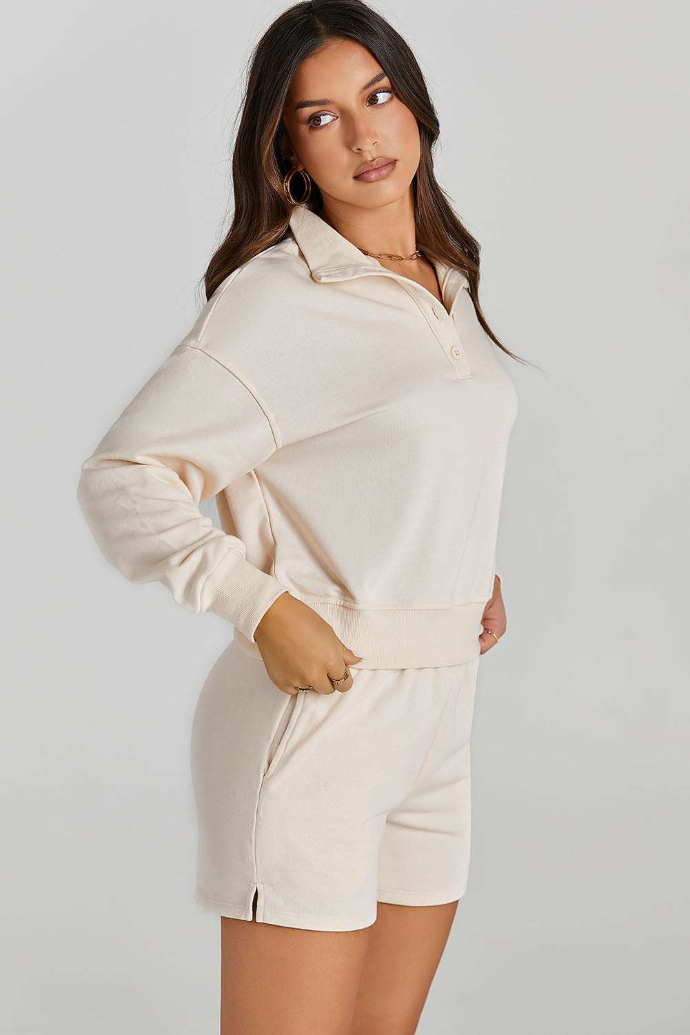 Half Button SweatshirtExpress Global Mart  Features: Pocketed
Number of pieces: Two-piece
Stretch: Slightly stretchy
Material composition: 65% polyester, 35% rayon
Care instructions: Machine wash cold. TumbleHalf Button Sweatshirt and Shorts Active SetTrendsi