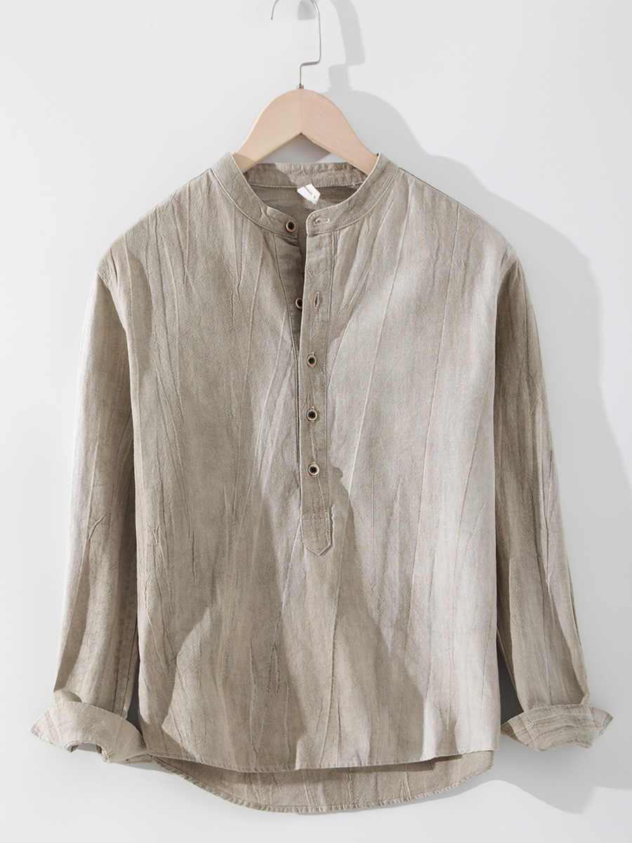 Linen Shirt Long Sleeved Stand Up Collar Retro Top Jacket in apricot color hanging on a hanger.