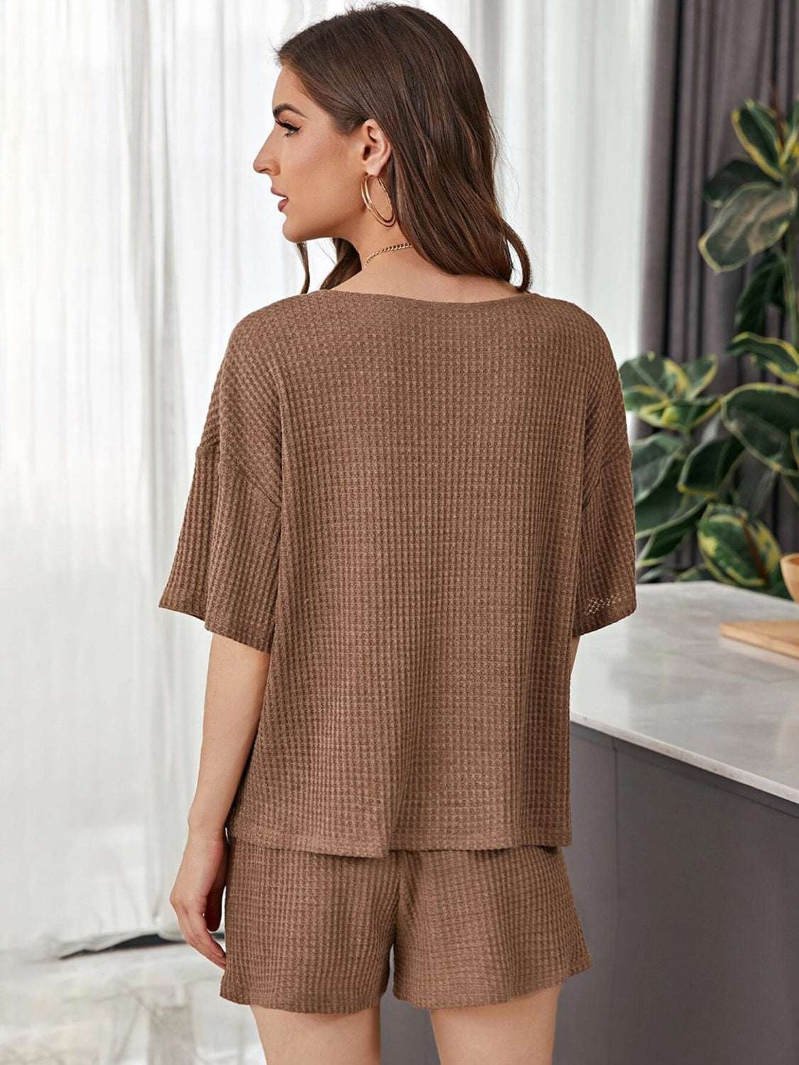 Full Size Waffle-Knit Dropped Shoulder TopExpress Global Mart  Features: Tied, Waffle-Knit
Number of pieces: Two-piece
Stretch: Slightly stretchy
Material composition: 100% polyester
Care instructions: Machine wash cold. Tumble Full Size Waffle-Knit Dropped Shoulder Top and Shorts SetTrendsi