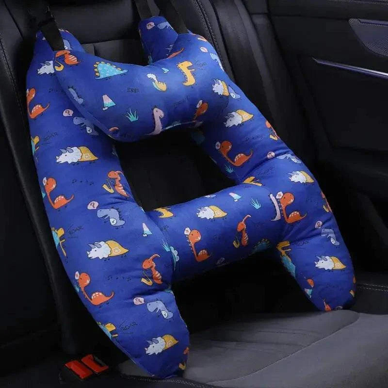 Kids car travel pillow on seat, blue with colorful print, ergonomically designed for neck support.