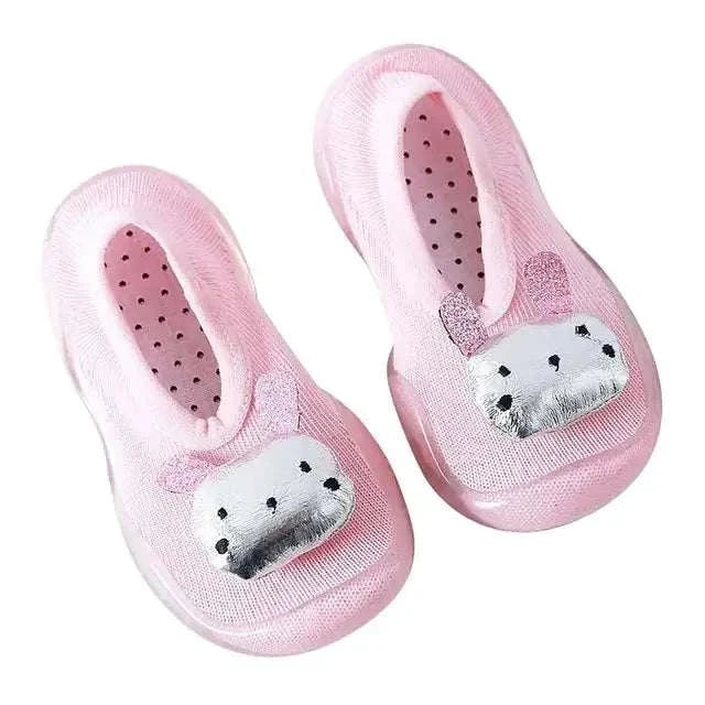 Pink toddler shoes with anti-slip soles and built-in cozy socks.